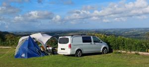 Campervan enjoying the view at Wesley House Campsite